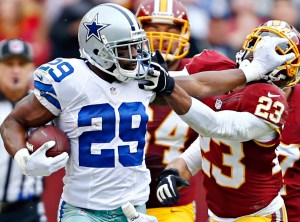 Dallas Cowboys running back DeMarco Murray (29) pushes away Washington Redskins cornerback DeAngelo Hall on a long carry during the first half as the Dallas Cowboys faced the Washington Redskins, Sunday, Dec. 22, 2013 at FedEx Field in Landover, MD. (G.J. McCarthy/Dallas Morning News/MCT)