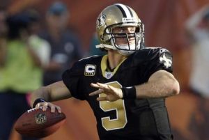 FILE - In this Oct. 25, 2009, fil ephoto, New Orleans Saints quarterback Drew Brees (9) steps back to pass in the second quarter against the Miami Dolphins during an NFL football game in Miami. Perhaps the secret to NFL perfection is having a Purdue quarterback on your roster. Don't believe it? The Saints, Broncos and Colts are a combined 18-0 this season, the only unbeaten teams in the league. New Orleans has Drew Brees and Denver has Kyle Orton, while the backup in Indianapolis is former Boilermaker Curtis Painter.  (AP Photo/Lynne Sladky, File)